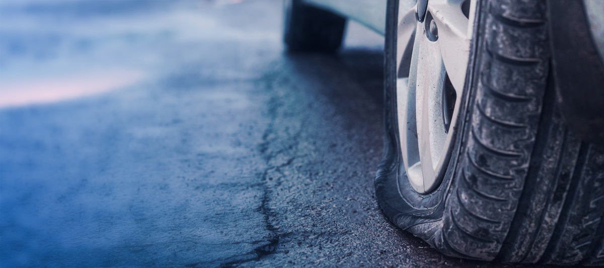 Car on ramp undergoing wheel alignment - Wheel Alignment Leeds